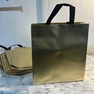 11 Sturdy Reusable Bags with handles in glossy gold.